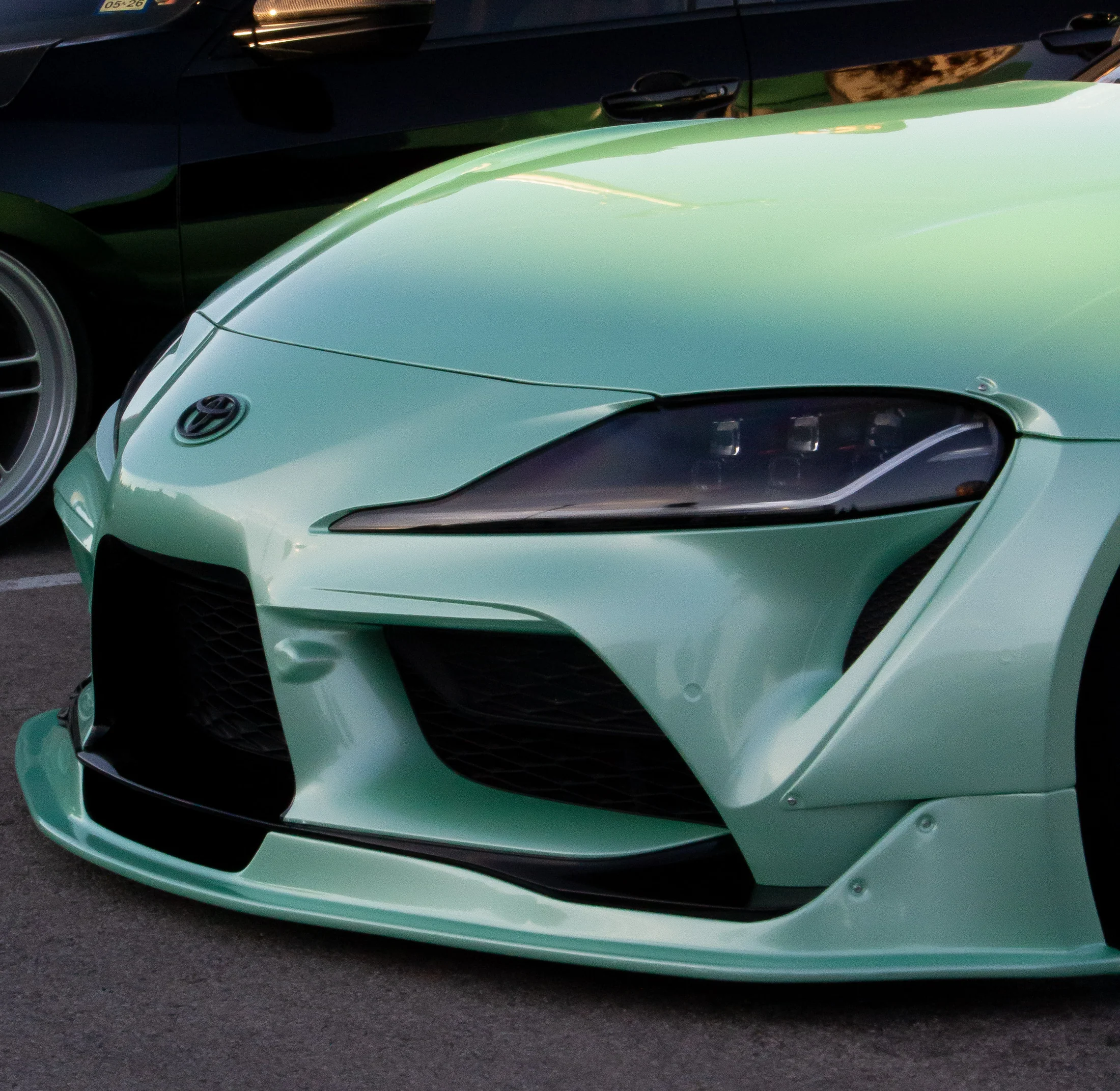 Turquoise sports car front detail