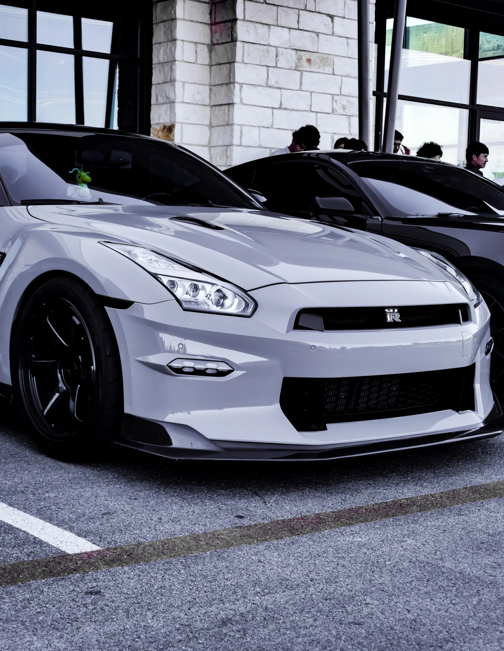 White Nissan GT-R at an indoor gathering