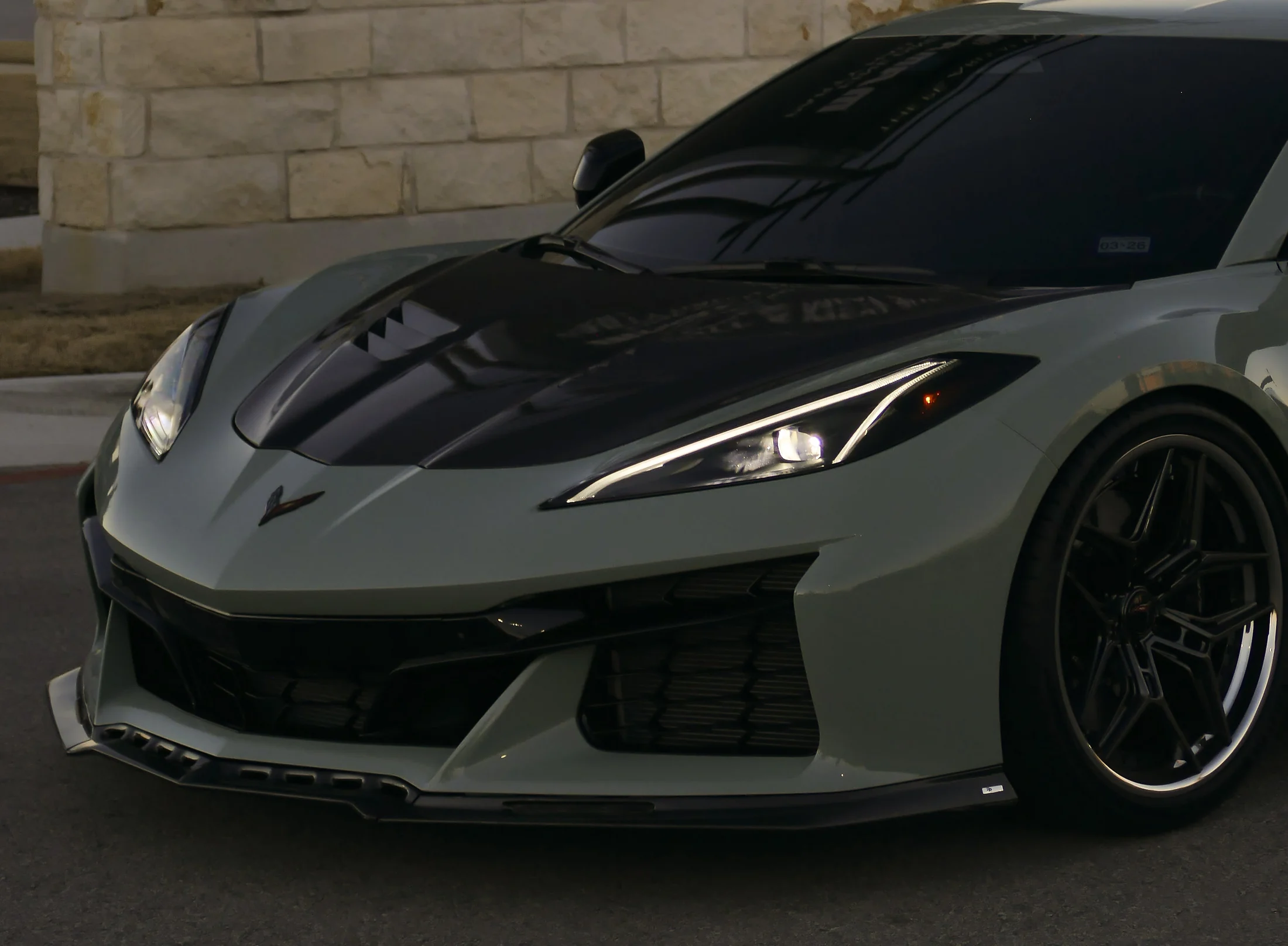 Gray performance car photographed from the front quarter