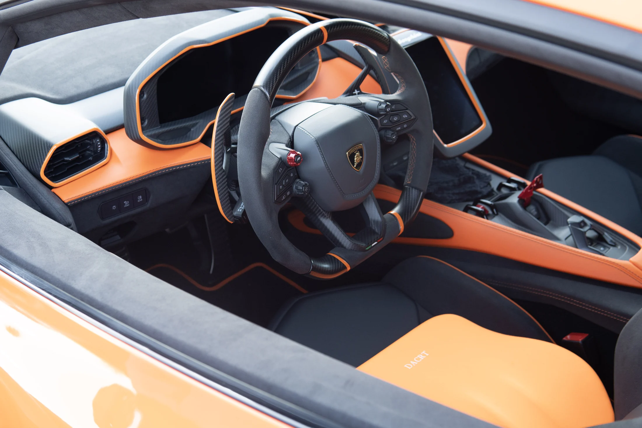 Orange and black Lamborghini cockpit